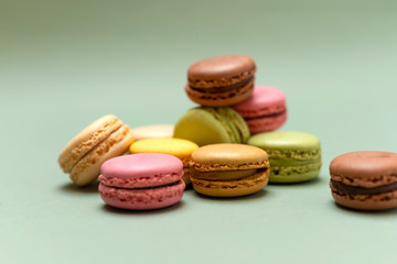Fototapeta na wymiar Above view of colorful macaroons on a marble background