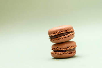 Front view of colorful macaroons on a marble background