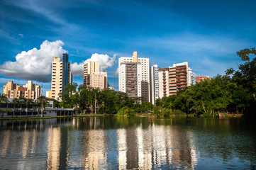 Fototapeta na wymiar blue sky over the buildings and the lake