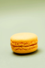 Above view of colorful macaroons on a marble background