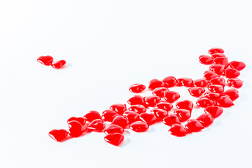 Valentine Hearts Background. Valentines Red. Valentine day white background with red hearts, top view, macro