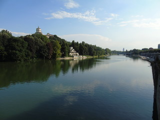 Turin, Italy - 12/01/2018: An amazing photography of the city of Turin from italy in summer days from the high and low part of the city including the beautiful river of Po from the center