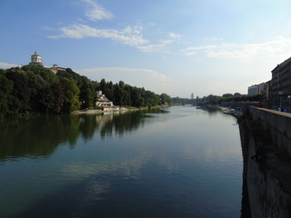 Turin, Italy - 12/01/2018: An amazing photography of the city of Turin from italy in summer days from the high and low part of the city including the beautiful river of Po from the center