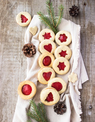 homemade linzer cookies heart-shaped and decorations on wooden table free space for text - holidays, winter, celebration, Valentine's day concept