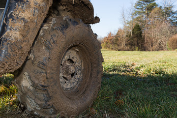 Fototapeta na wymiar Muddy all-terrain vehicle tire