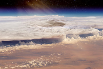 Hurricane over the sandy desert. Collage. The elements of this image furnished by NASA.