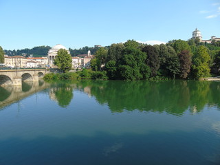 Turin, Italy - 12/01/2018: An amazing photography of the city of Turin from italy in summer days from the high and low part of the city including the beautiful river of Po from the center