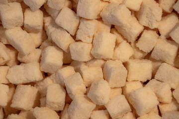 dried cubes of coconut fruit background