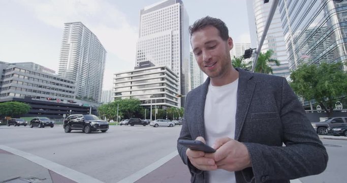 Happy Young Man Businessman Portrait Talking On Phone. Smiling Confident Business Man Using Cell Smartphone App In Central Business District (CBD) Of Miami. City Lifestyle People In Miami, Florida USA