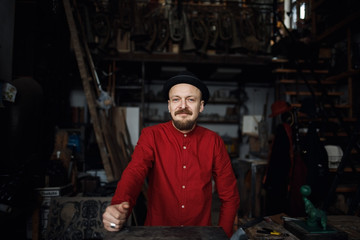 Fototapeta na wymiar Portrait of an artist in his workshop