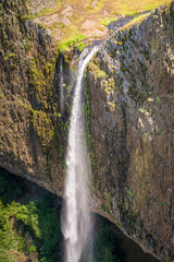 Phantom Waterfall dropping off over vertical basalt walls, North Table Mountain Ecological Reserve, Oroville, California