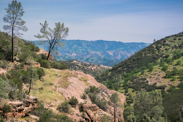 View from the high peaks trail towards the valleys and hills of Pinnacles National Park, California