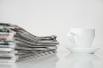 Reading newspaper on white background