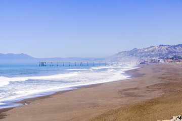 View towards the Municipal Pier, Pacifica as seen from Mori Point, Marin County in the background, California