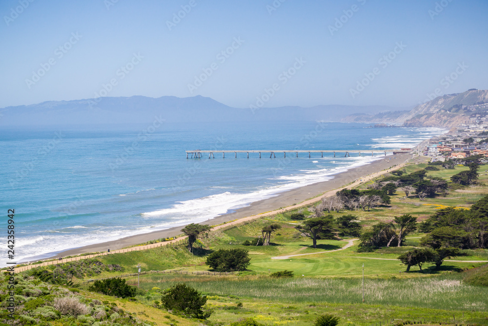 Wall mural aerial view of pacifica municipal pier and sharp park golf course as seen from the top of mori point