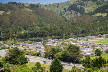 Fototapeta na wymiar Aerial view of Highway 1 going through Pacifica, San Francisco bay area, California