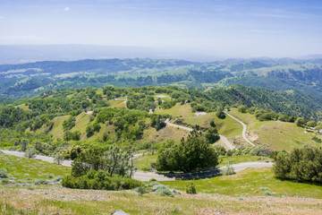 Fototapeta premium Dangerously winding road going down from Mt Hamilton summit, San Jose, San Francisco bay area, California