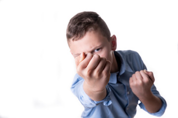 Violence in school - fist of a young child in front of his face