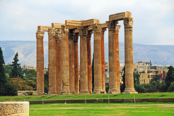 The huge archeological column ruins of the Temple of Olymian Zaus in Athens, Greece with blue sky copy space.