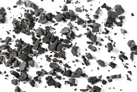 Black coal pile isolated on white background, top view