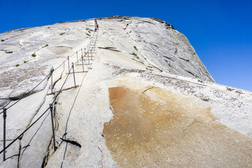 Going up on the Half Dome cables on a sunny summer day, Yosemite National Park, California
