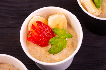 Porridge in a shota with berries and mint