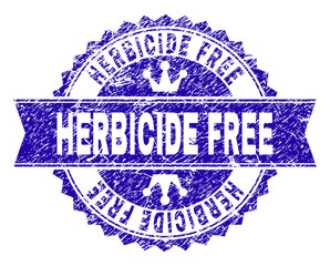 HERBICIDE FREE rosette stamp seal watermark with grunge style. Designed with round rosette, ribbon and small crowns. Blue vector rubber watermark of HERBICIDE FREE title with grunge style.