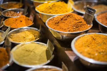 Many bowls of spices in market