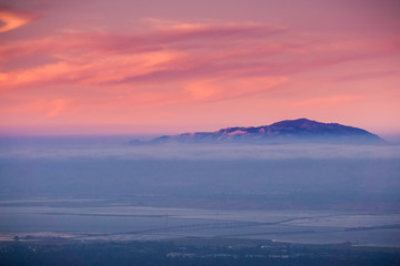 Clouds and fog at twilight over the San Francisco bay area; Mt Diablo in the background