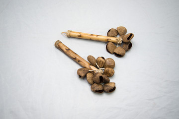 Ethnic musical instrument. Rattle of seeds with a handle.
