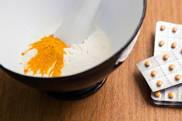 Herbs powder in the mortar and pestle