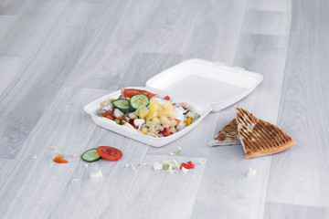 fast food vegetable salad with pineapple and cucumber in box