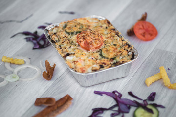 vegetables and meat together baked in box to take away