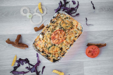 vegetables and meat together baked in box to take away