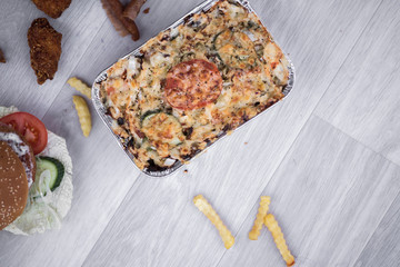 vegetables and meat together baked in box to take away