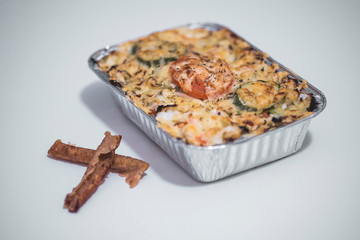 vegetables and meat together baked in box to take away
