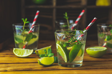 Mojito cocktail in a bur on a rustic table, selective focus
