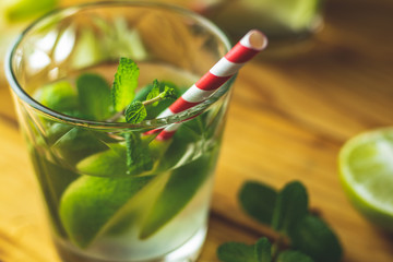 Mojito cocktail in a bur on a rustic table, selective focus