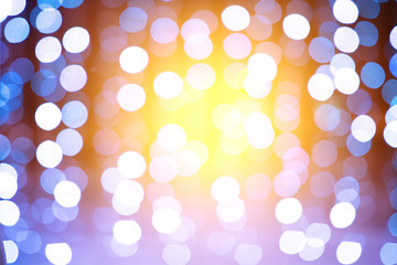 Blue bokeh background with bright light.