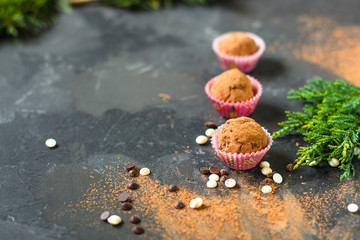 candies, chocolate, handmade (stuffed dried fruit) sweets on a dark background. Top view. copy space