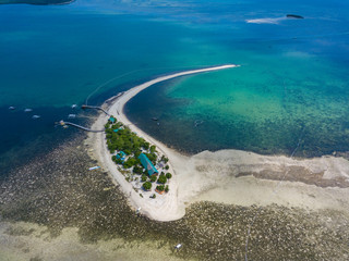 Aerial view of curved beach of Pontod virgin island located near Panglao island, Bohol, Philippines