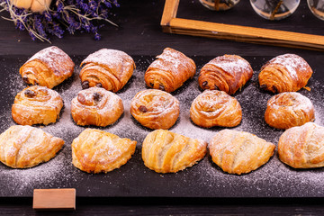 Pastries with apple, with nut and raisin in icing sugar