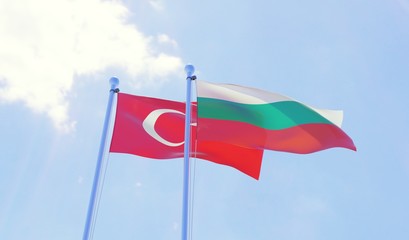 Turkey and Bulgaria, two flags waving against blue sky. 3d image