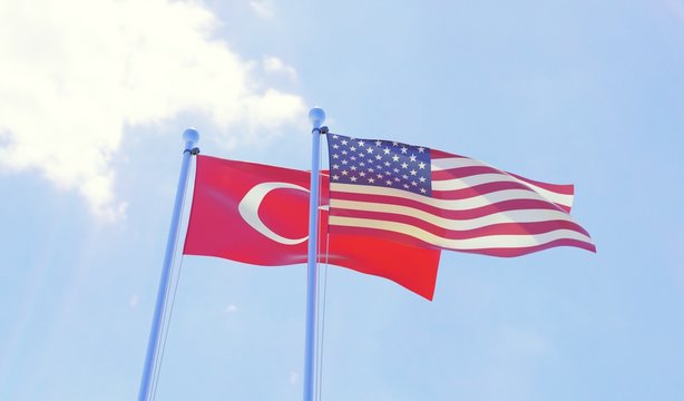 Turkey and USA, two flags waving against blue sky. 3d image