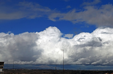 Fototapeta na wymiar Blue sky with clouds and antenna