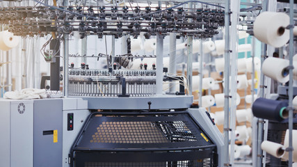 Knitted fabric. Textile factory in spinning production line and a rotating machinery and equipment production company.