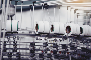 Obraz premium Knitted fabric. Textile factory in spinning production line and a rotating machinery and equipment production company.