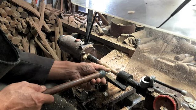 Carpenter Woodworking, detail of a worker with a lathe, shaping wood, etara, bulgaria