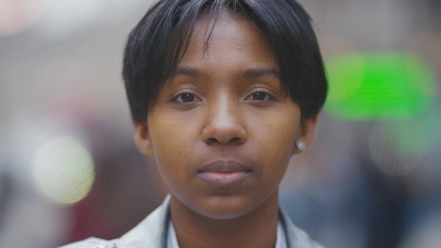Portrait of young transgender man looking to camera