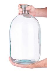 Glass jar in hand on white background